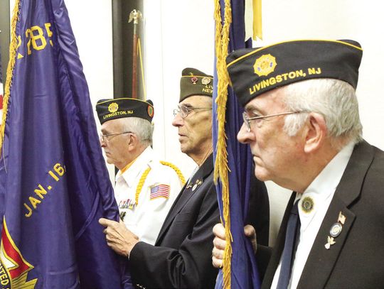 At left, veteran and Livingston High School alumnus Samir Patel leads the line of march during the posting of colors. Above, at the ceremony, are Peter Brady, Marty Halo and William Brady.