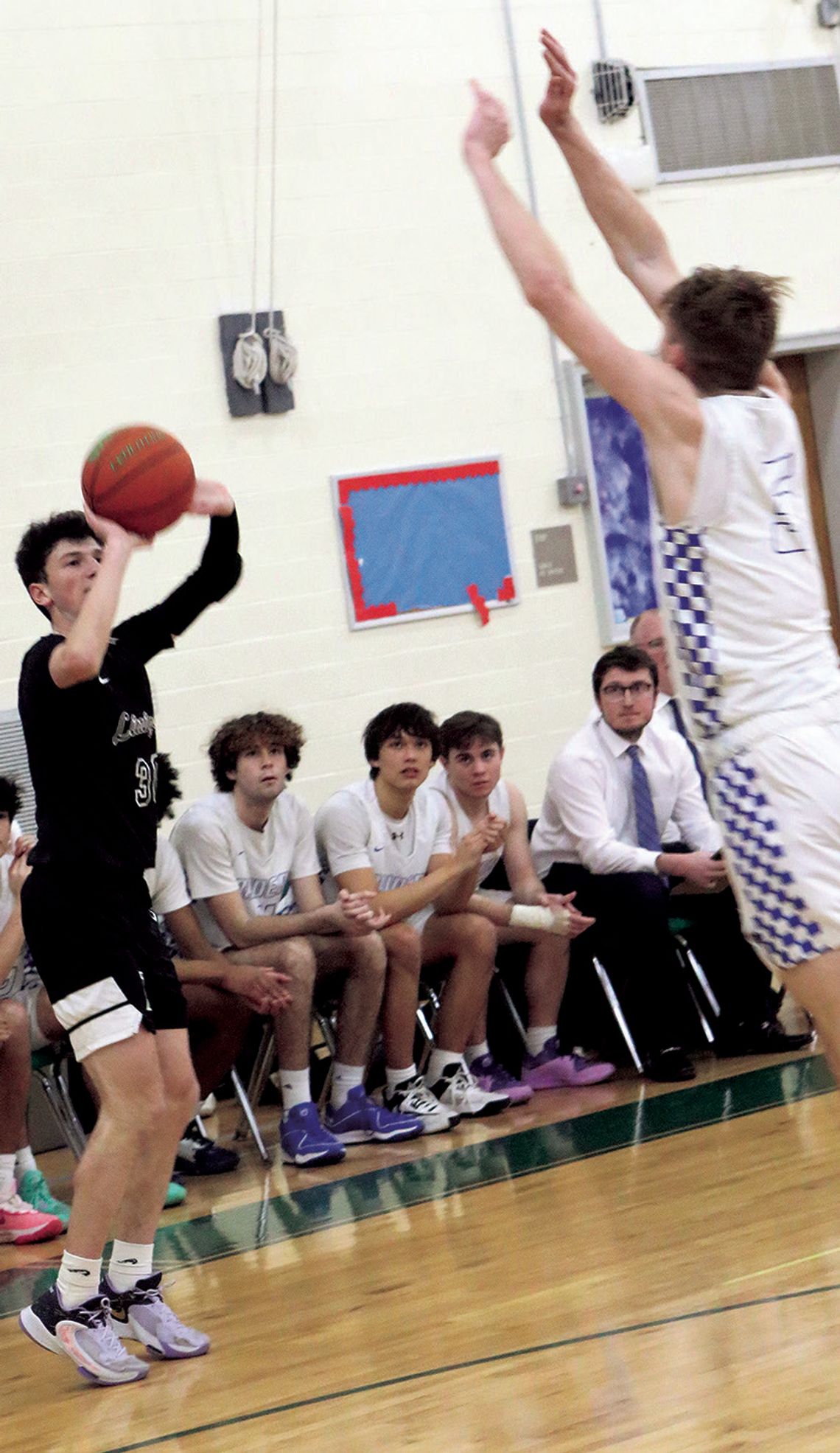 VARSITY BOYS’ BASKETBALL FALLS TO RAIDERS